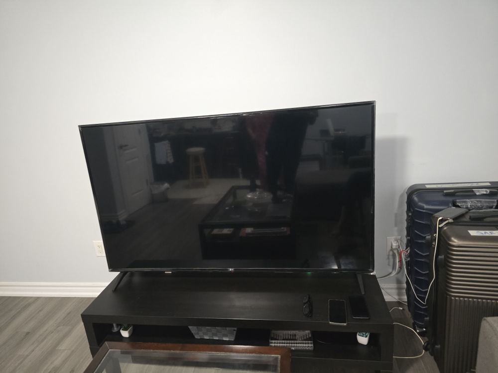 65" inch LG webOS TV UK6090PUA with table