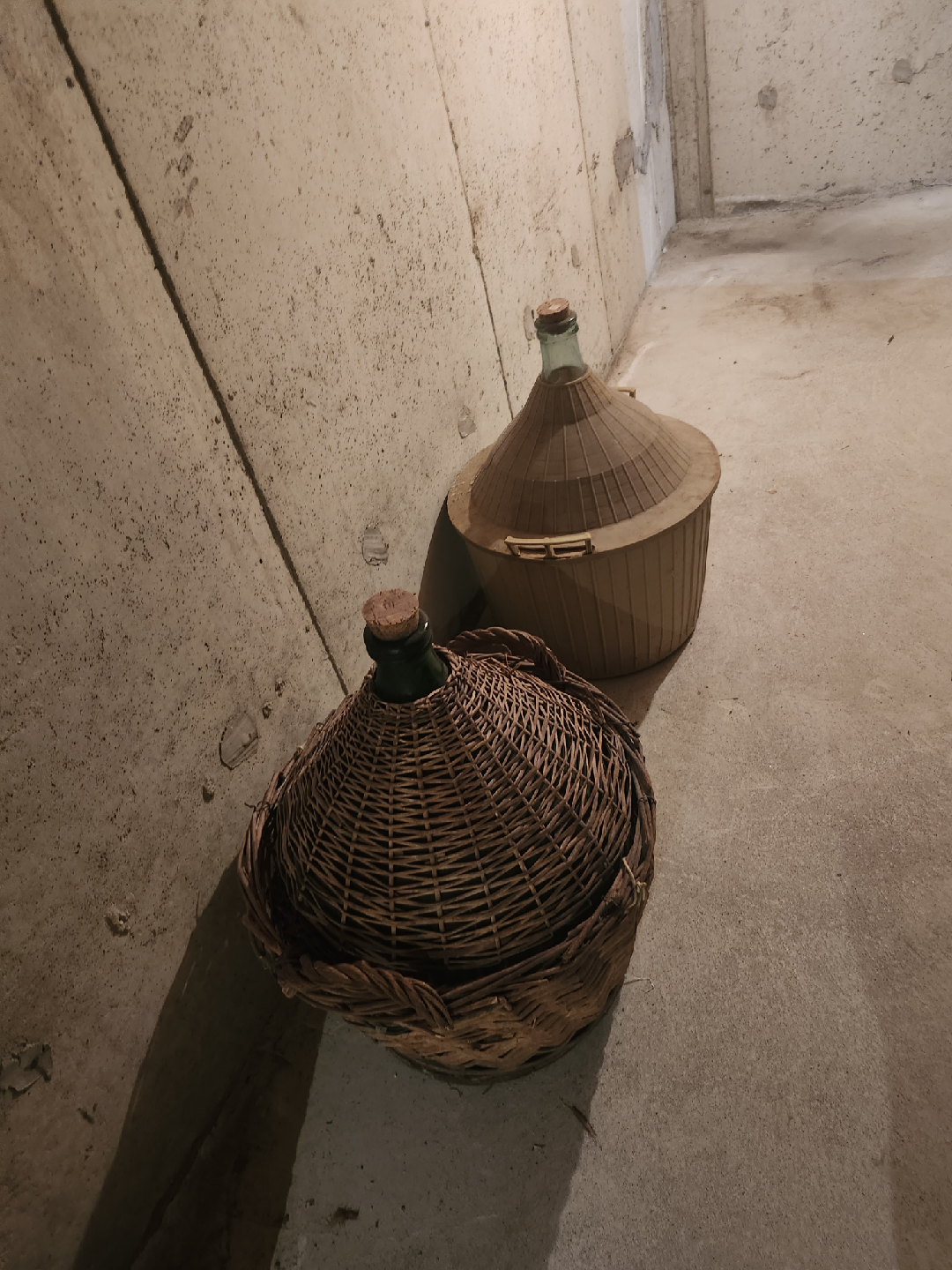 Wicker-Covered Glass Demijohns