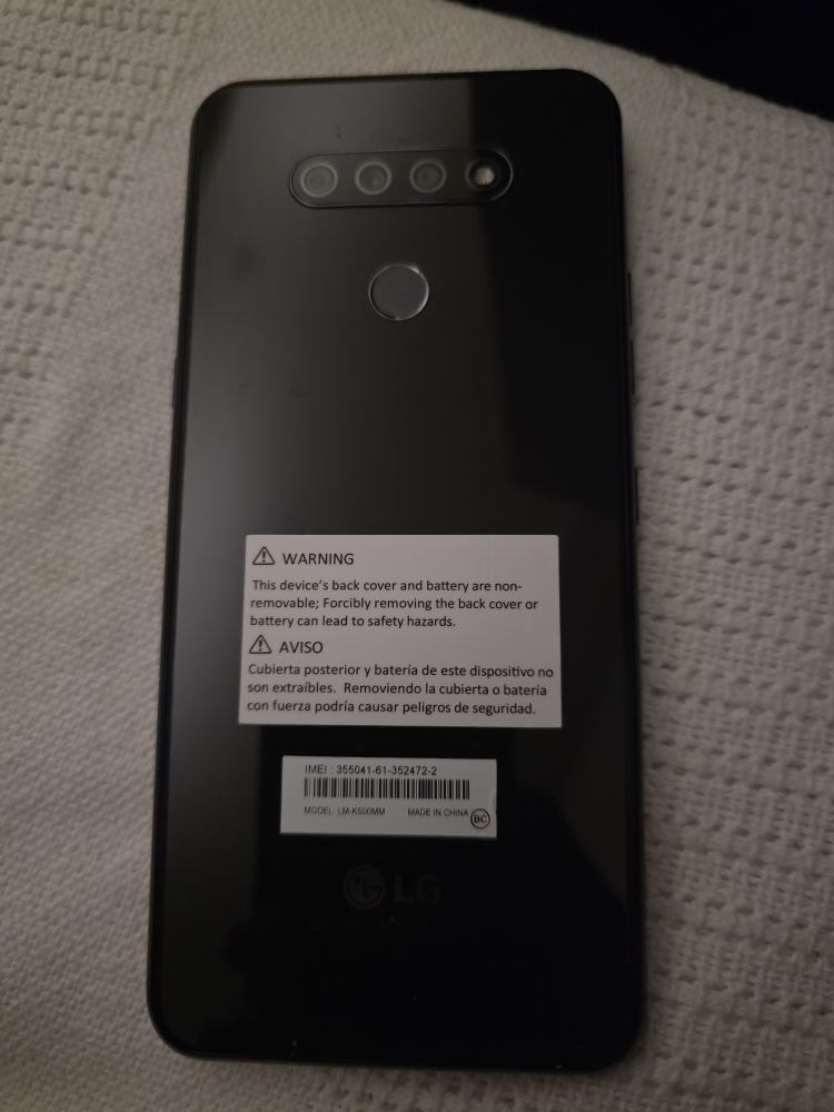 LG K500MM Cell Phone with Red Case
