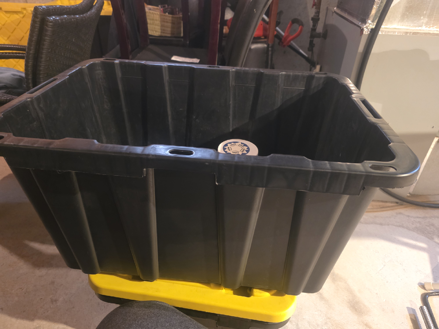 Black container full of concrete screws and Ramset shot nails