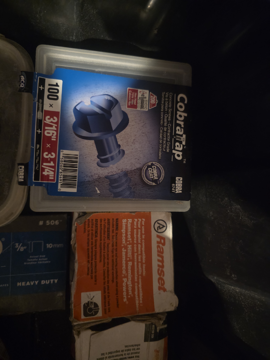 Black container full of concrete screws and Ramset shot nails - photo 3