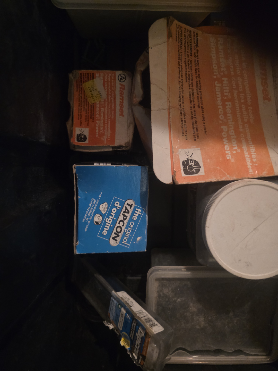 Black container full of concrete screws and Ramset shot nails - photo 4