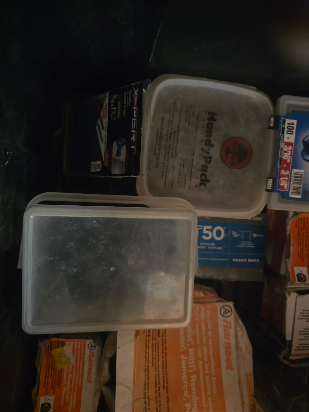 Black container full of concrete screws and Ramset shot nails image indicator(5)