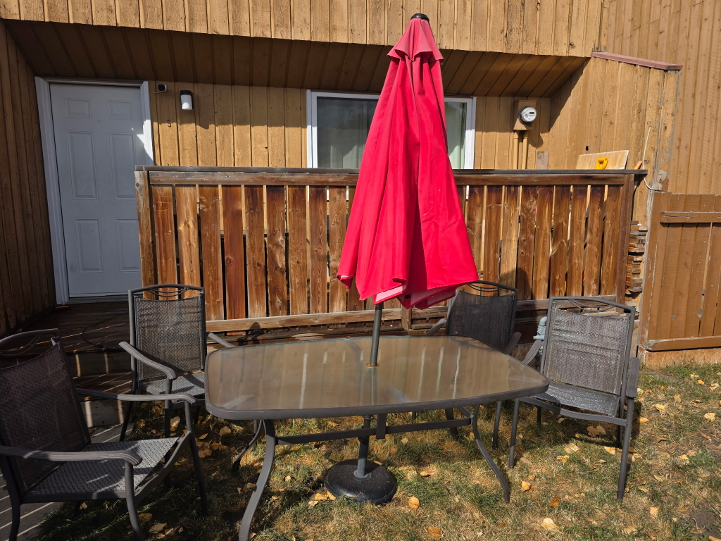 patio table and chairs with an umbrella - photo 3