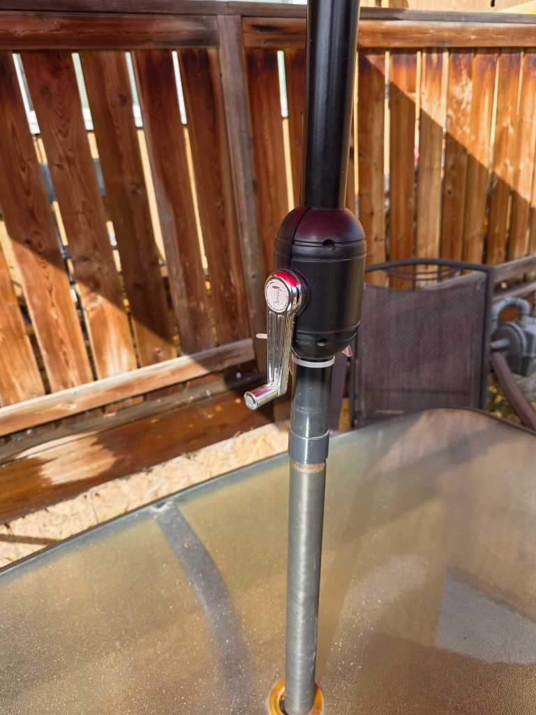 patio table and chairs with an umbrella - photo 4