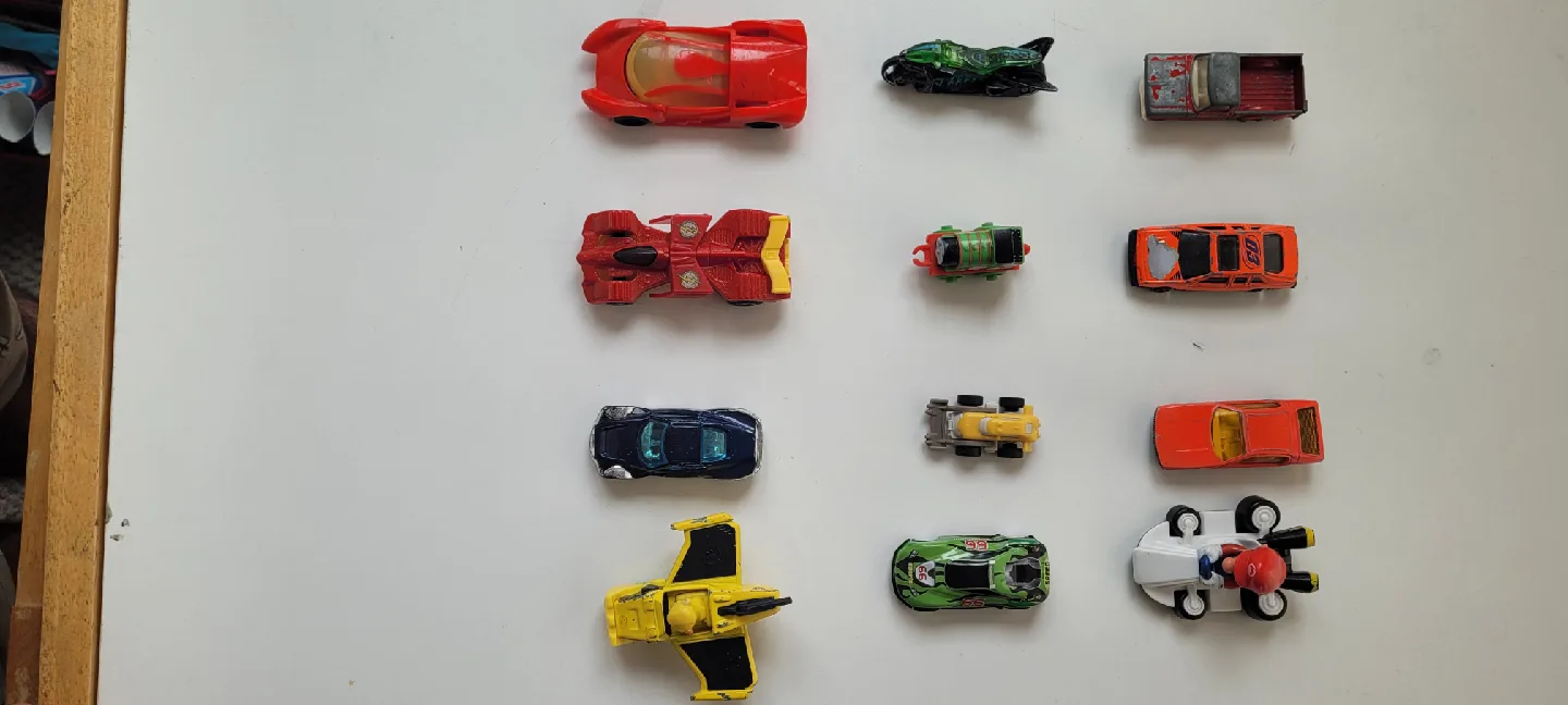 Assorted Toys: Sunglasses, Teddy Bear, Toy Cars image indicator(4)