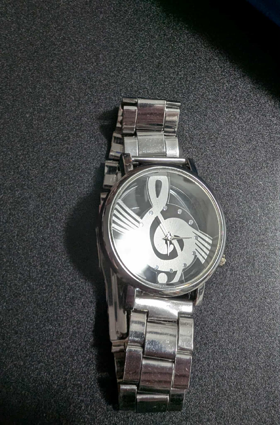 Silver Watch with Music Note Design
