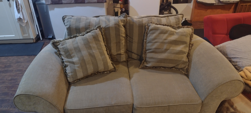 Beige Loveseat with Striped Pillows