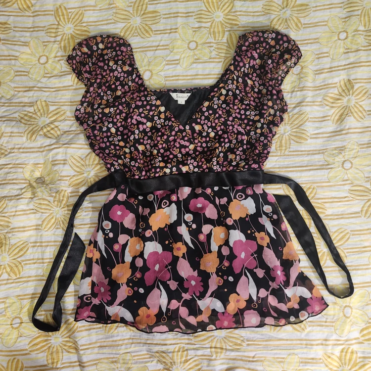 Black and pink floral babydoll top with a bow at the back