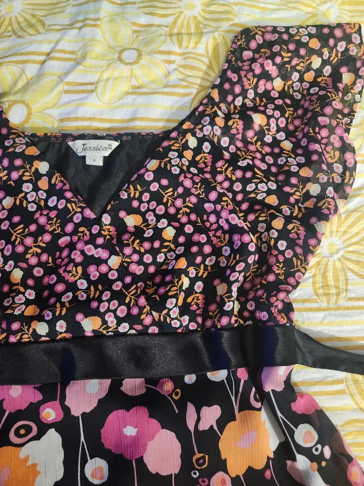 Black and pink floral babydoll top with a bow at the back image indicator(3)