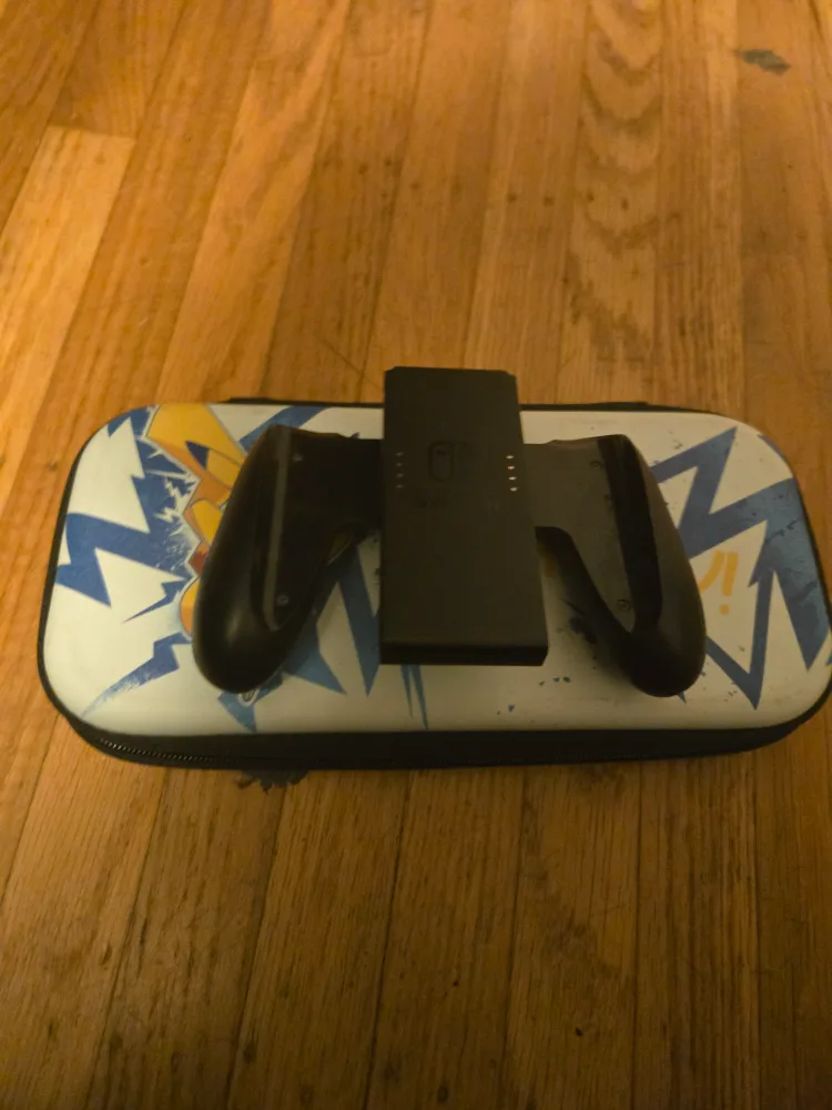 Nintendo Switch with Pikachu Case, game & RC Loader image indicator(3)