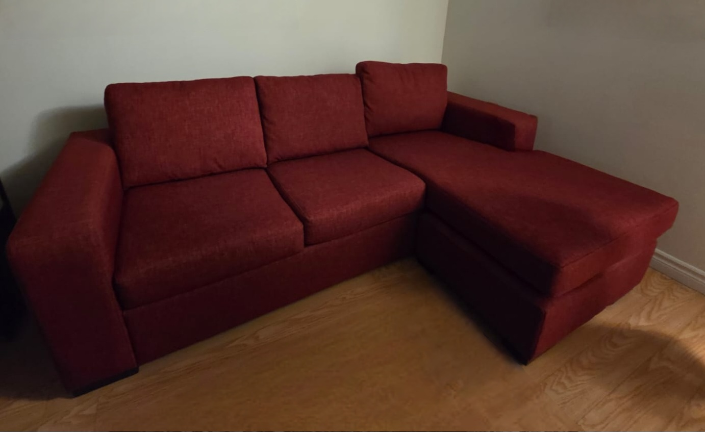 Red Sectional Sofa with Chaise and pull out bed.