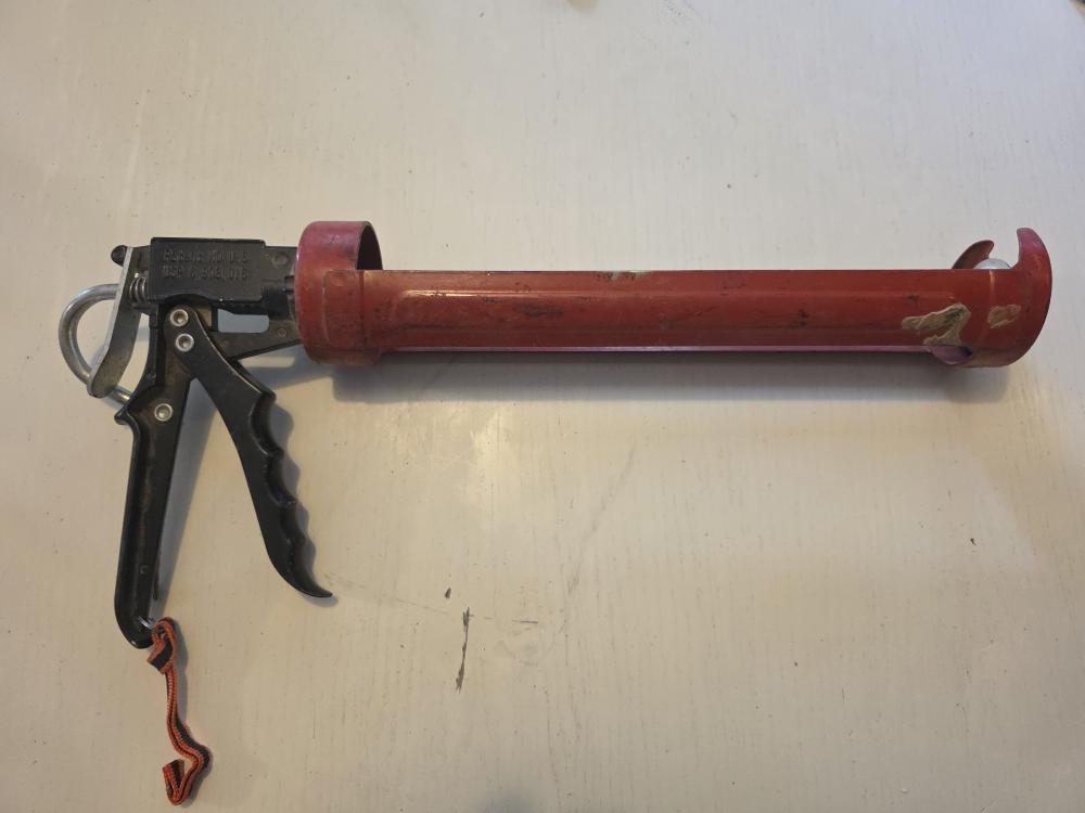 Red Caulking Gun