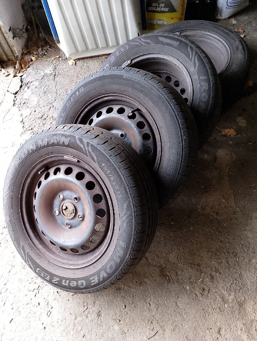 Four 15in 195/65R15 91H M+S tires on VW rims from a Rabbit
