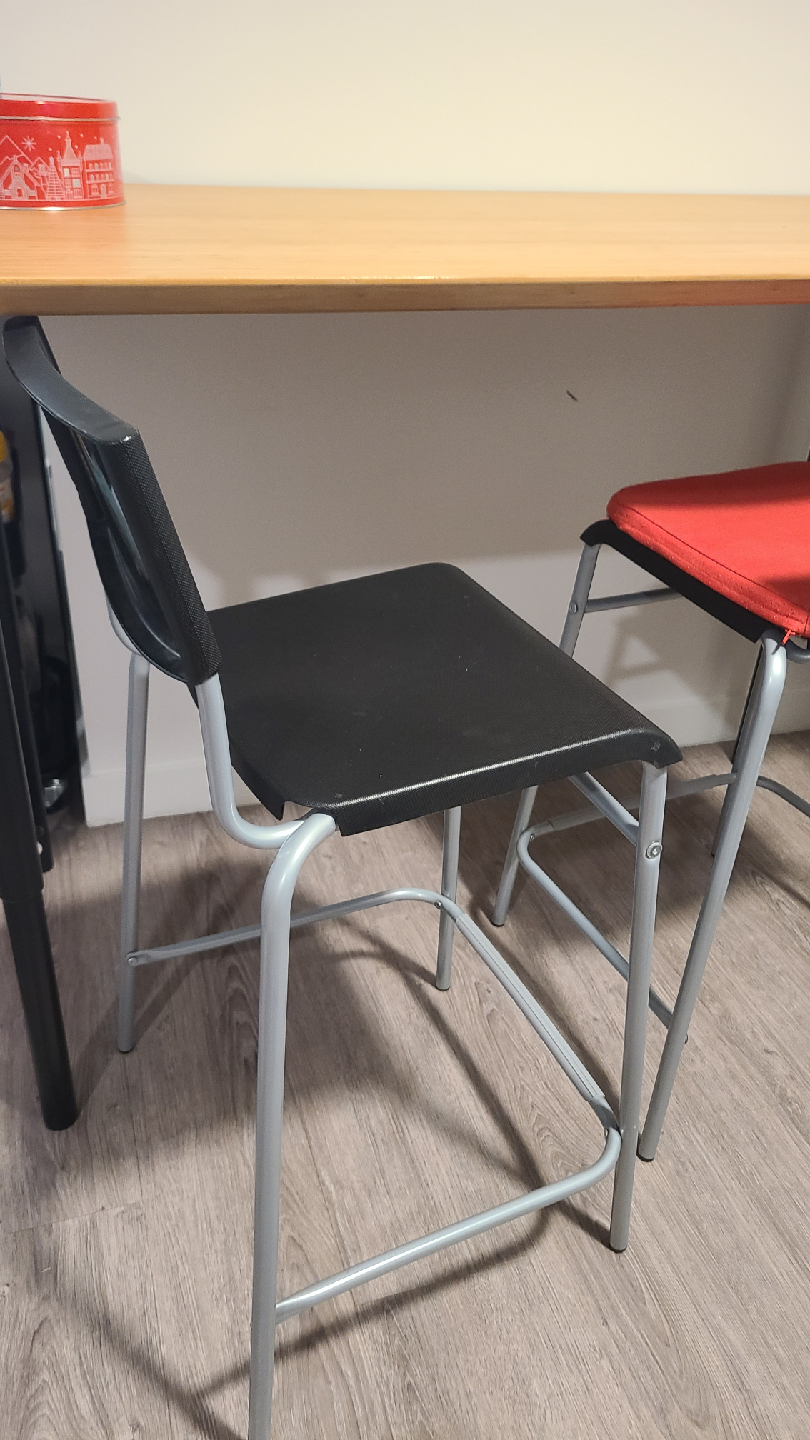 a pair of Ikea Black Bar stools/chairs with cusions