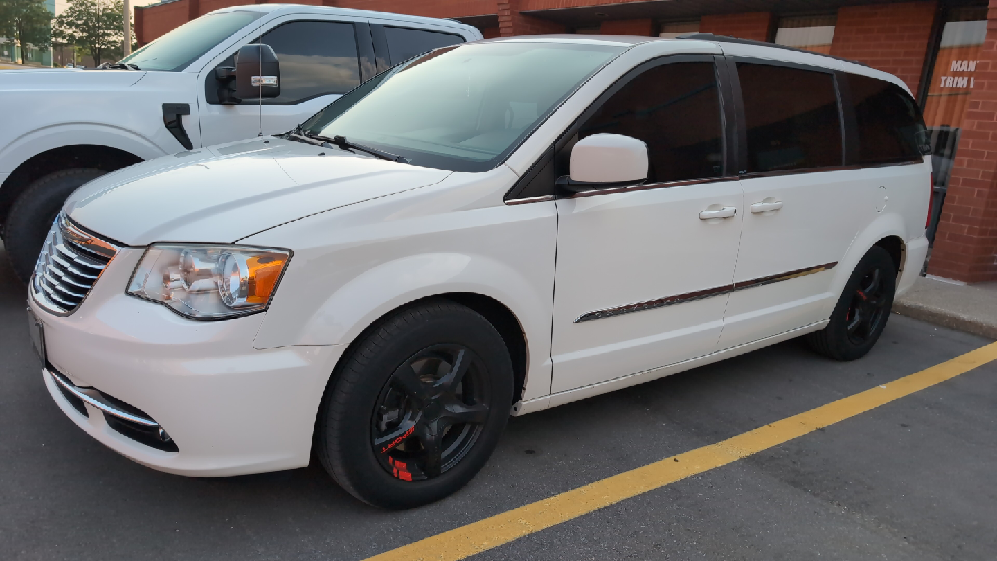 White Chrysler Town & Country Minivan