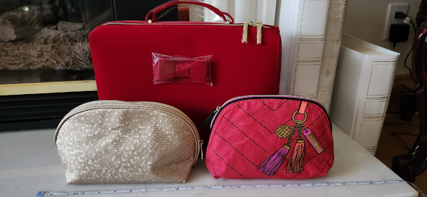 Estee Lauder red travel case with bonus