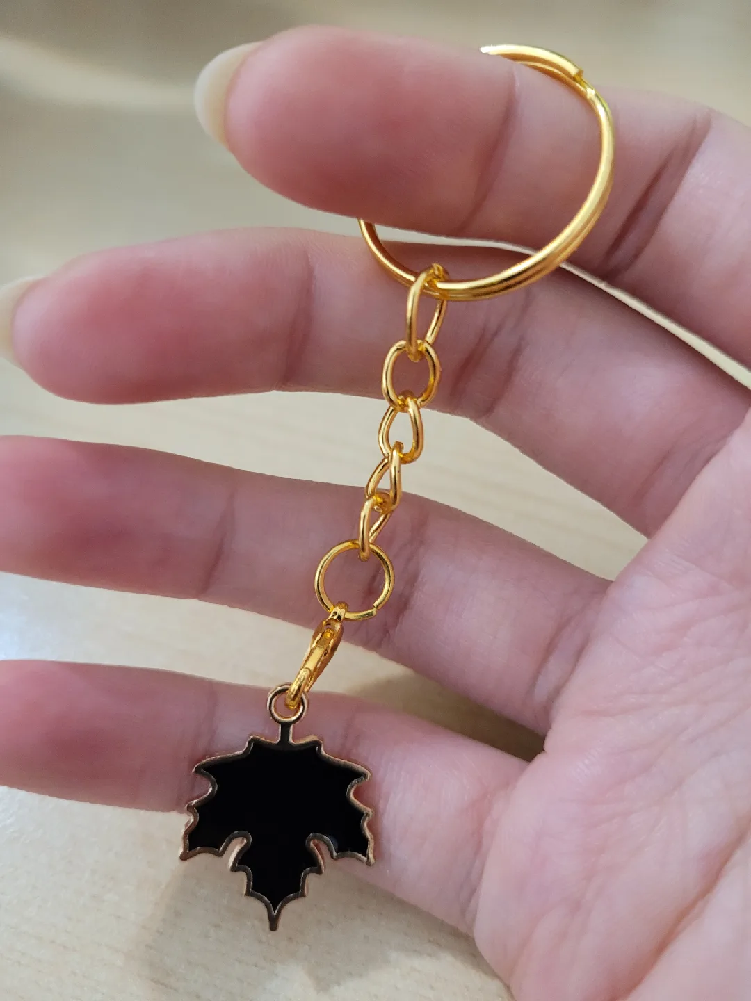 Maple Leaf Keychain - Black & Golden image indicator(4)