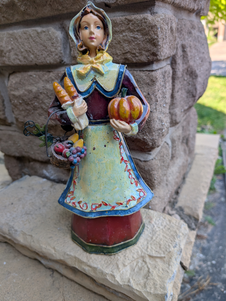 Pilgrim Woman Figurine with Harvest Basket