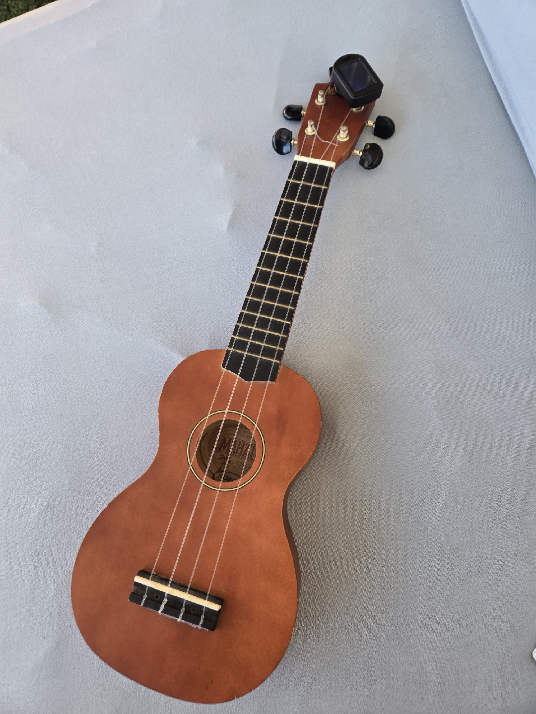 Mahalo real wood ukelele with tuner.