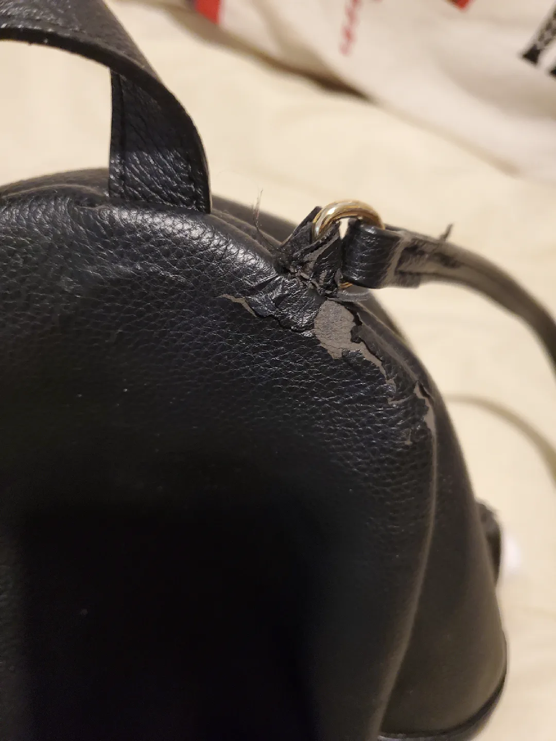 Victorias Secret black mini backpack with gold-like chain accent image indicator(8)