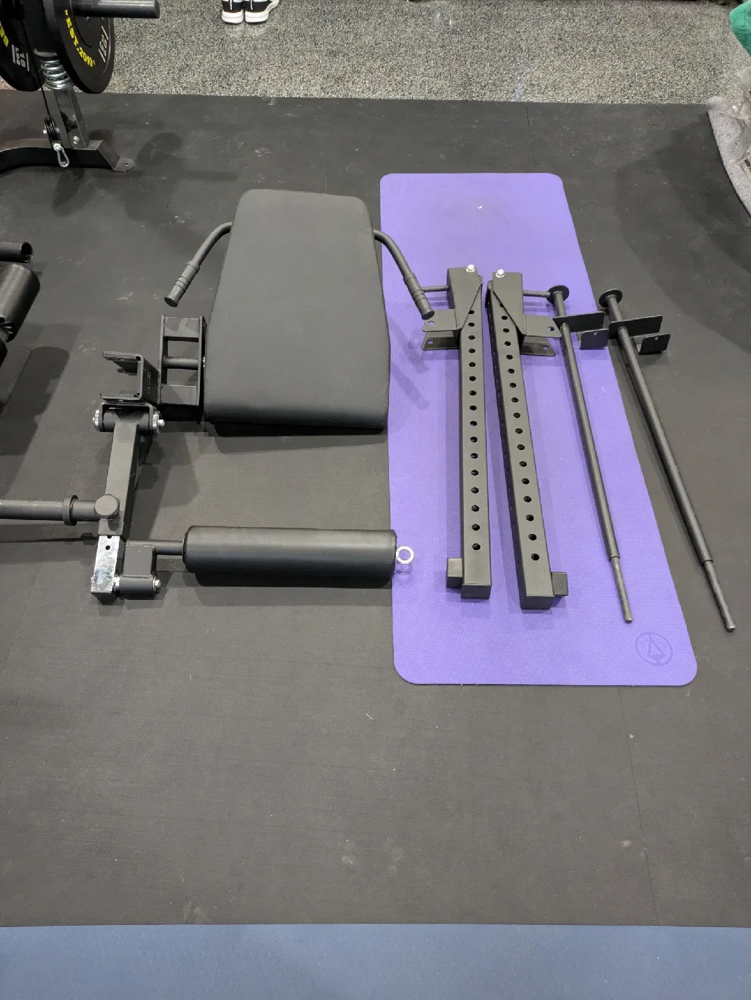 lever arm and leg extension attachment for squat rack
