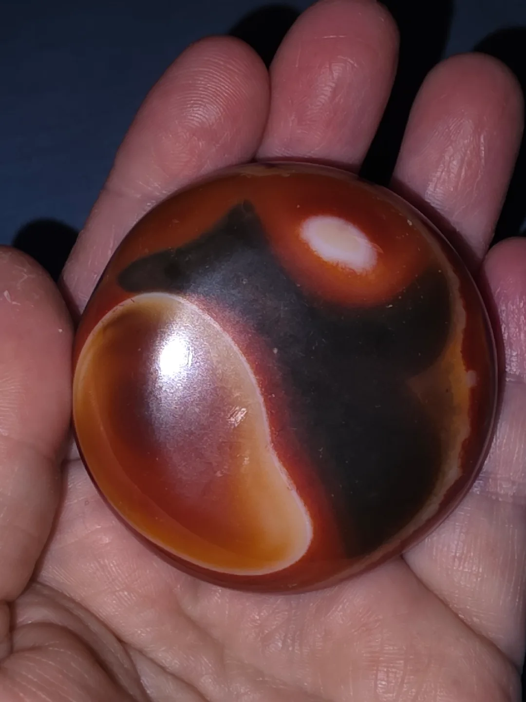 Carnelian palmstone puck thumbnail