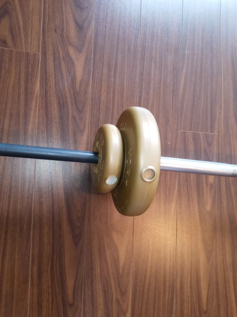 weight bar with some weights - photo 2