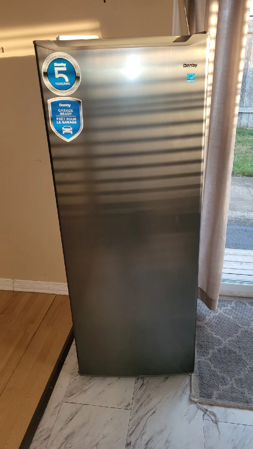 Couch, chair, end tabl,fireplace. image indicator(6)