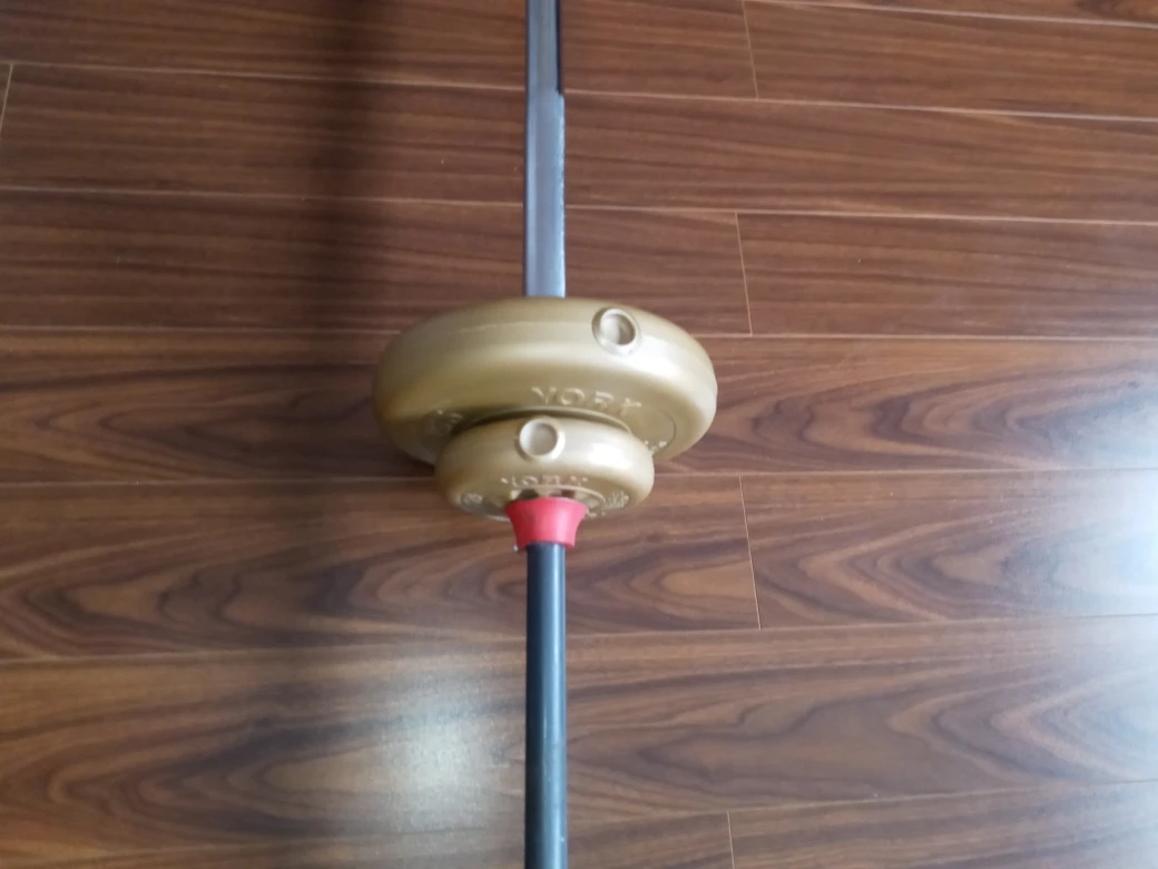 weight bar with some weights - photo 4