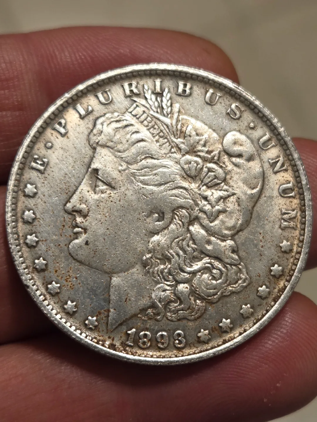 One 1893 CC silver dollar. image indicator(2)