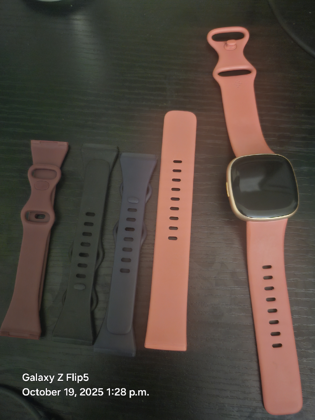 Fitbit Versa 4 with extra bands and charger