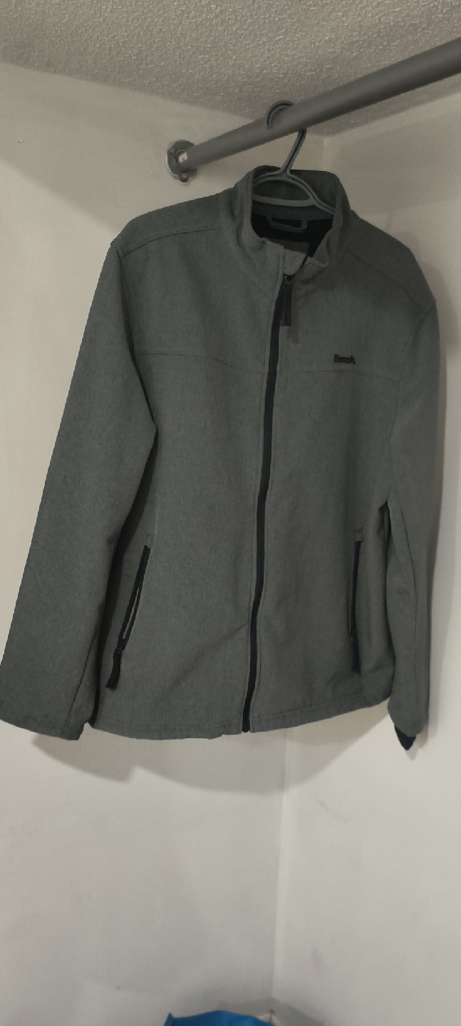 Bench. Gray Jacket