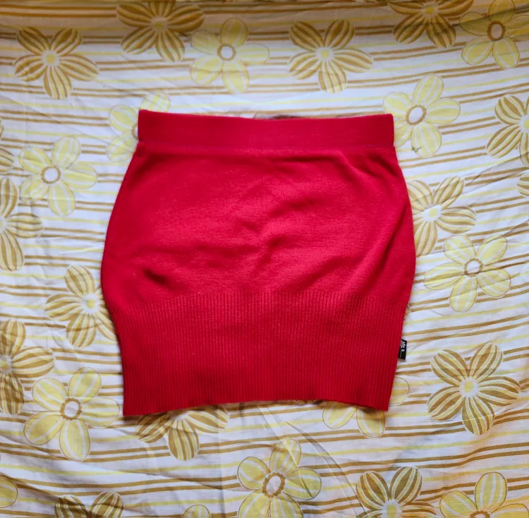 Red and black Bum Warmer mini sweater skirt with flower detail image indicator(2)