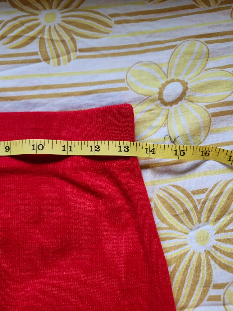 Red and black Bum Warmer mini sweater skirt with flower detail image indicator(6)