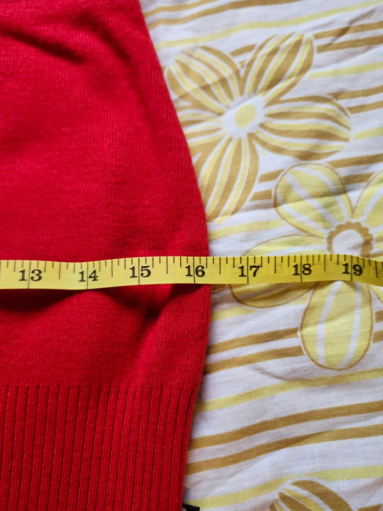 Red and black Bum Warmer mini sweater skirt with flower detail image indicator(7)