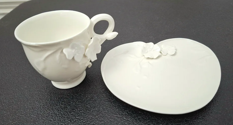 White Ceramic Teacup & Saucer Set image indicator(2)