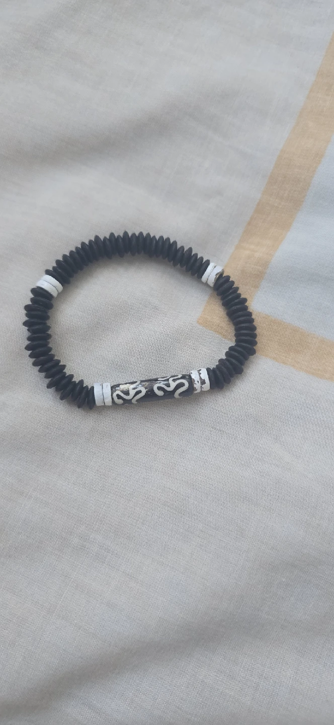 Black beaded bracelet with white details