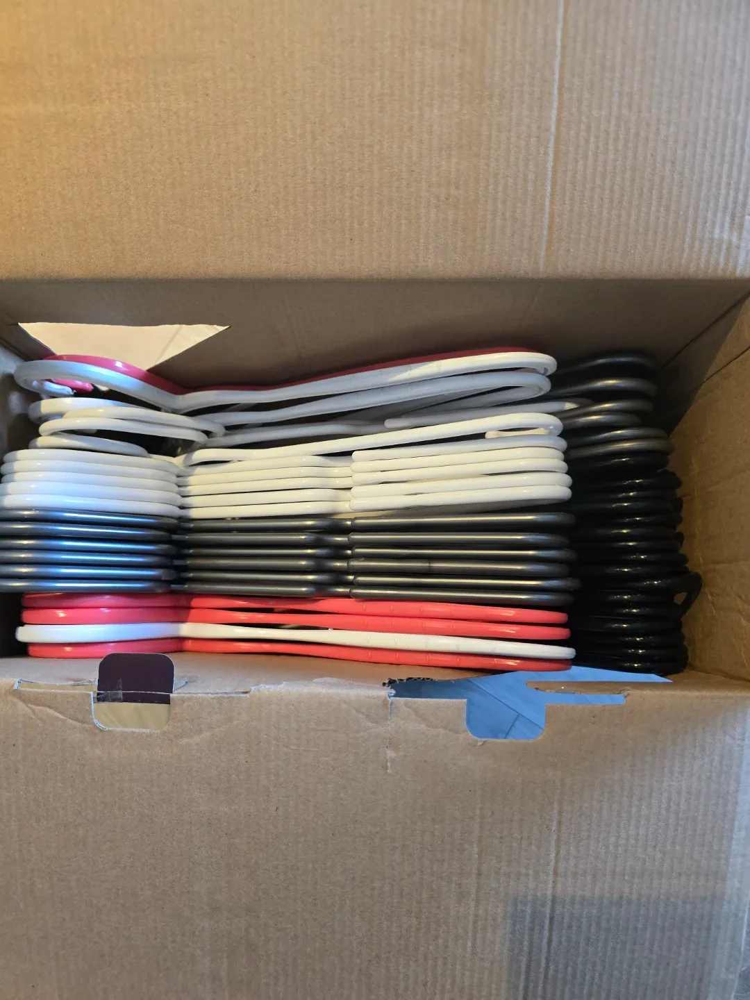 Box of Mixed Plastic Clothes Hangers