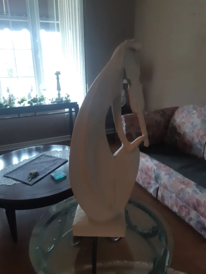 Lady playing violin sculpture