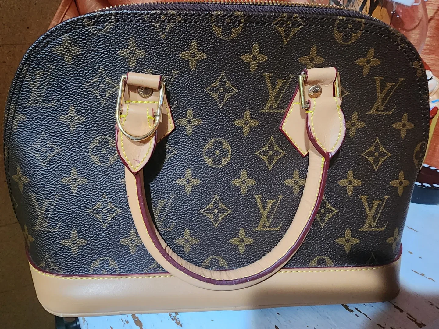 Louis Vuitton Alma Handbag Brown image indicator(5)