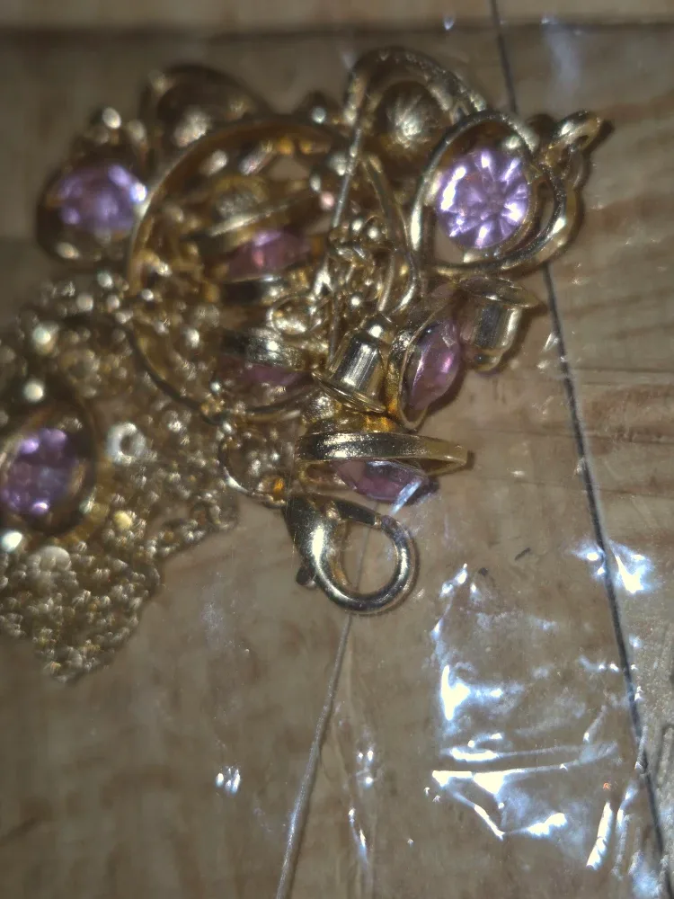 Gold-tone necklace with purple stones image indicator(2)