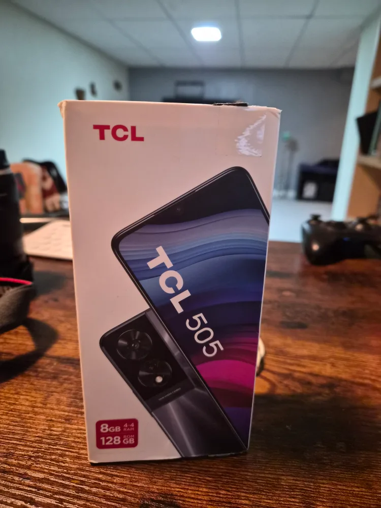 Open box, yet never used. TCL 505 Ocean Blue Smartphone