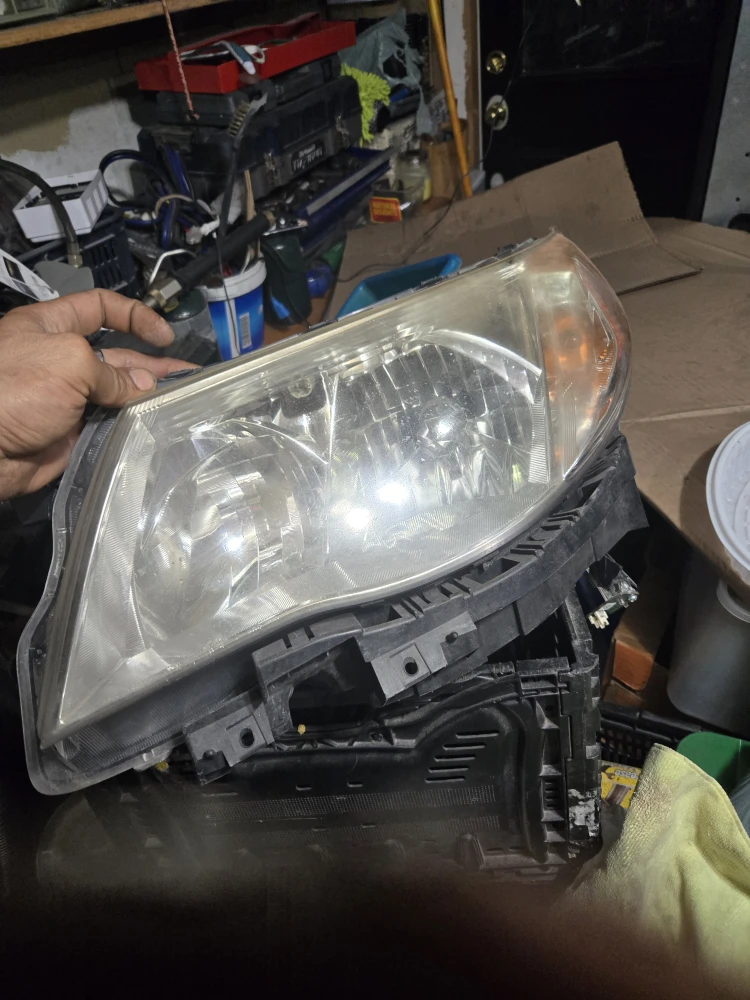 2010 Subaru Foster front left headlight with Xeon bulbs