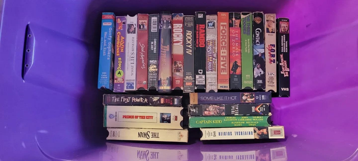 VHS Movie Tapes - Assorted Titles, 3 layers, purple tote