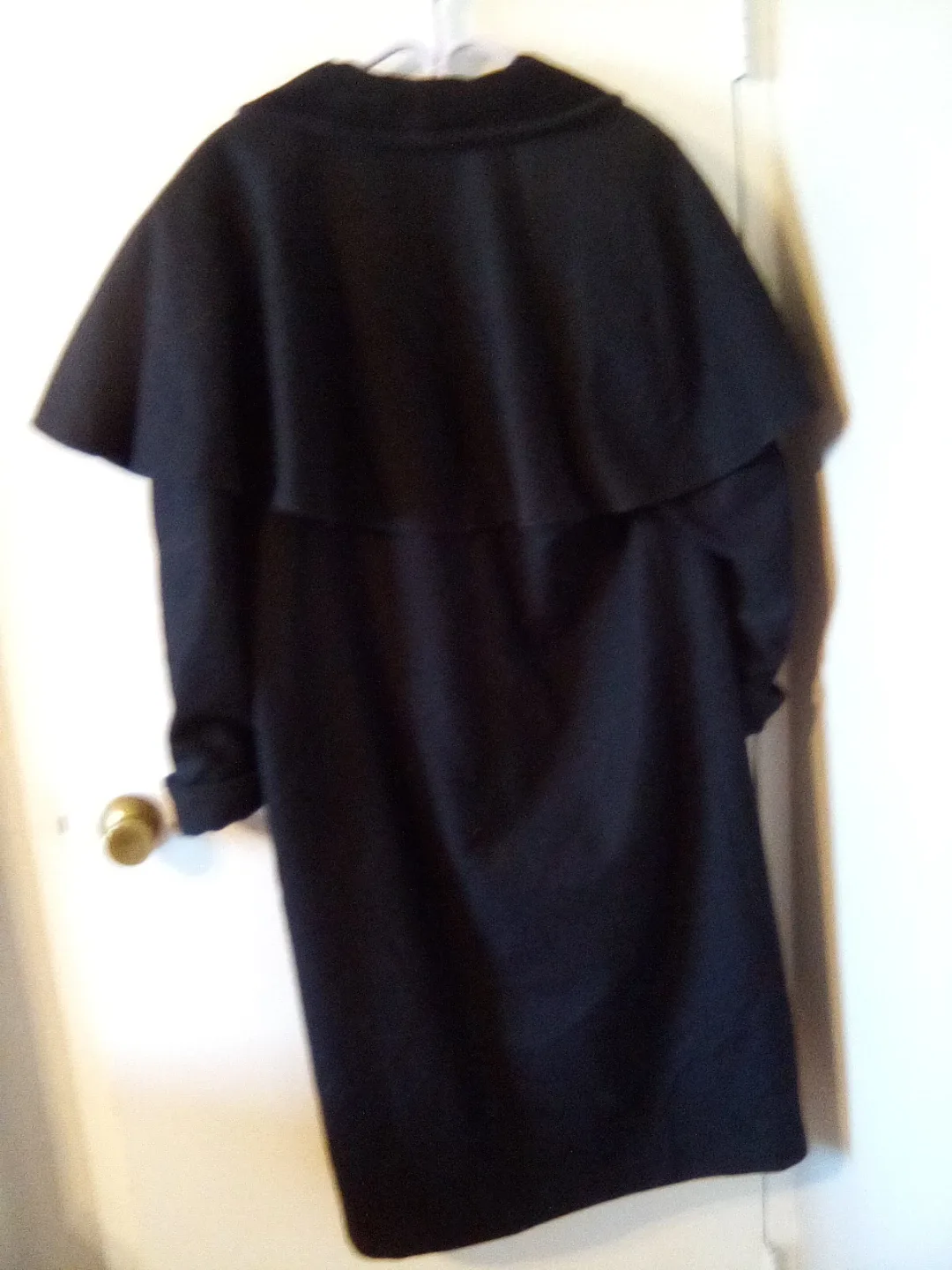 Sophisticated black wool cape coat image indicator(2)