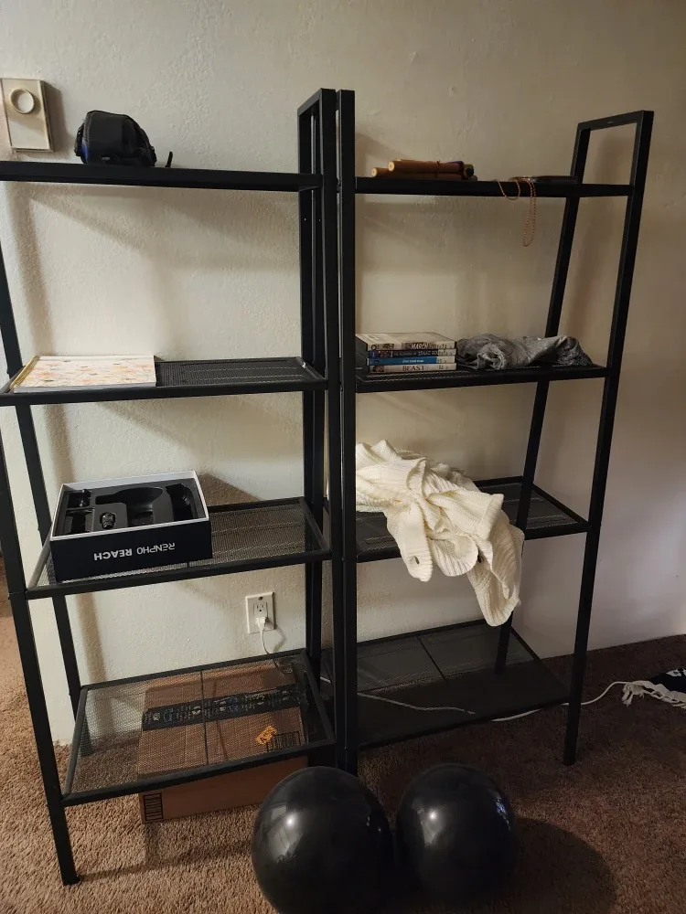 Two Black Metal Shelving Units