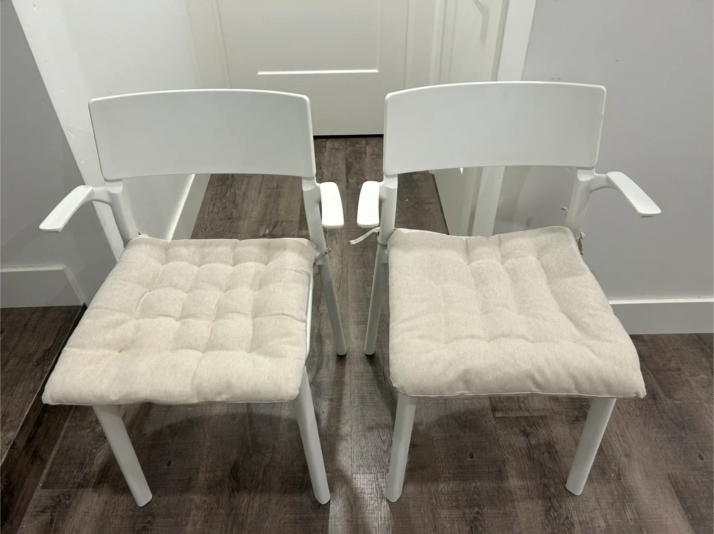 pair of IKEA chairs with cushions thumbnail