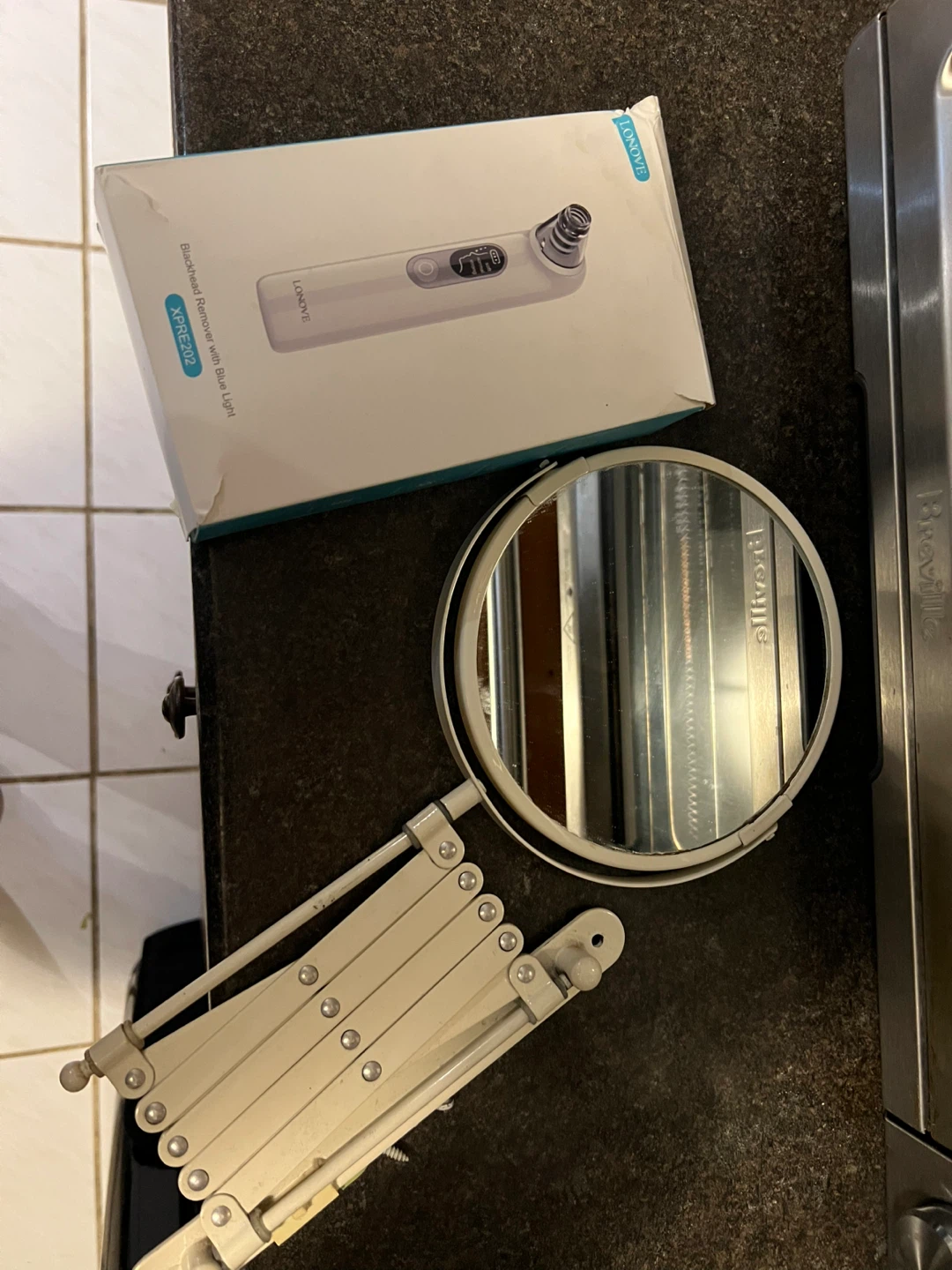 Bathroom mirror and black head remover