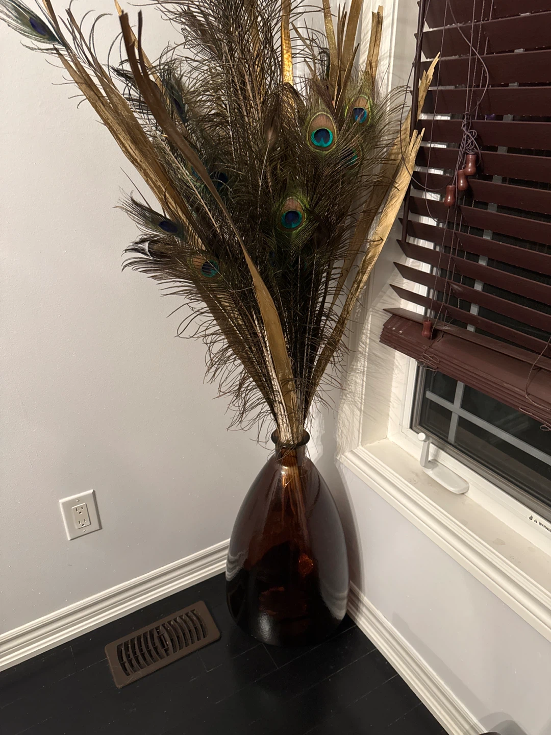 Decorative Peacock Feather Arrangement in Brown Glass Vase
